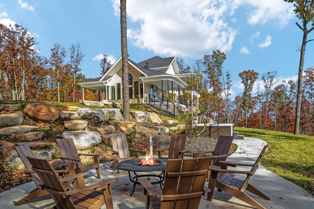 Outdoor fire pit seating area with mountain views at The Vale luxury cabin in Lost River West Virginia