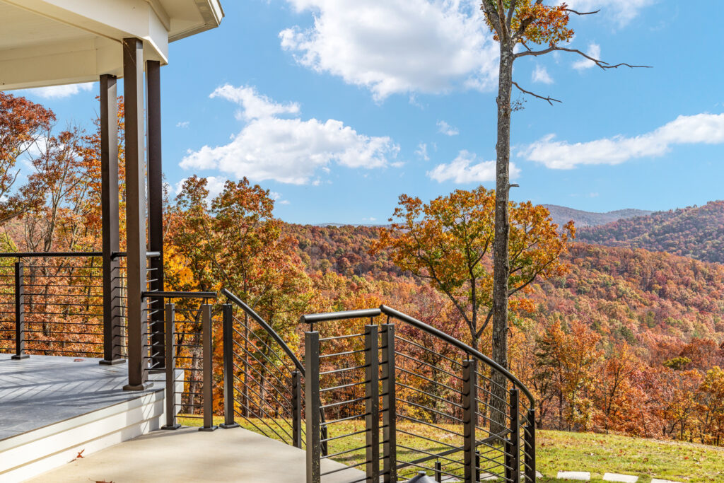 Expansive mountain and forest views from the deck at The Vale luxury cabin in Lost River West Virginia