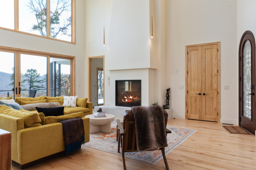 Ground floor living room with the fireplace and unobstructed views of the mountains in Lost River, West Virginia