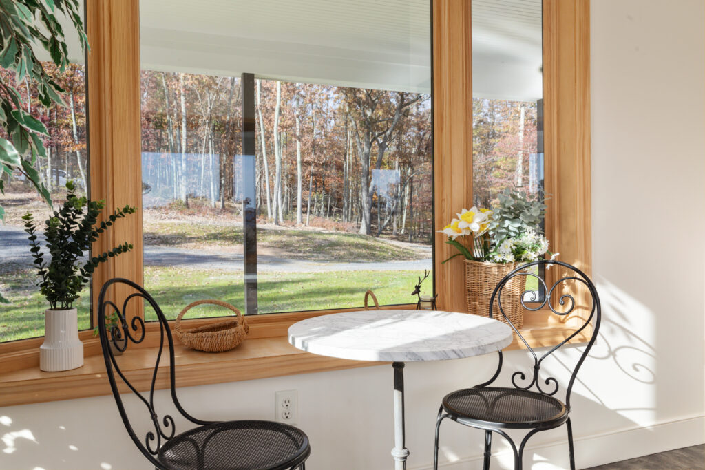 Sunroom romantic seating at The Vale luxury cabin in Lost River, West Virginia