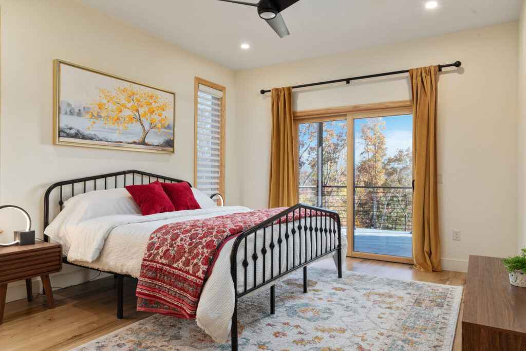Ground floor bedroom with ensuite bathroom and private balcony at The Vale in Lost River, West Virginia