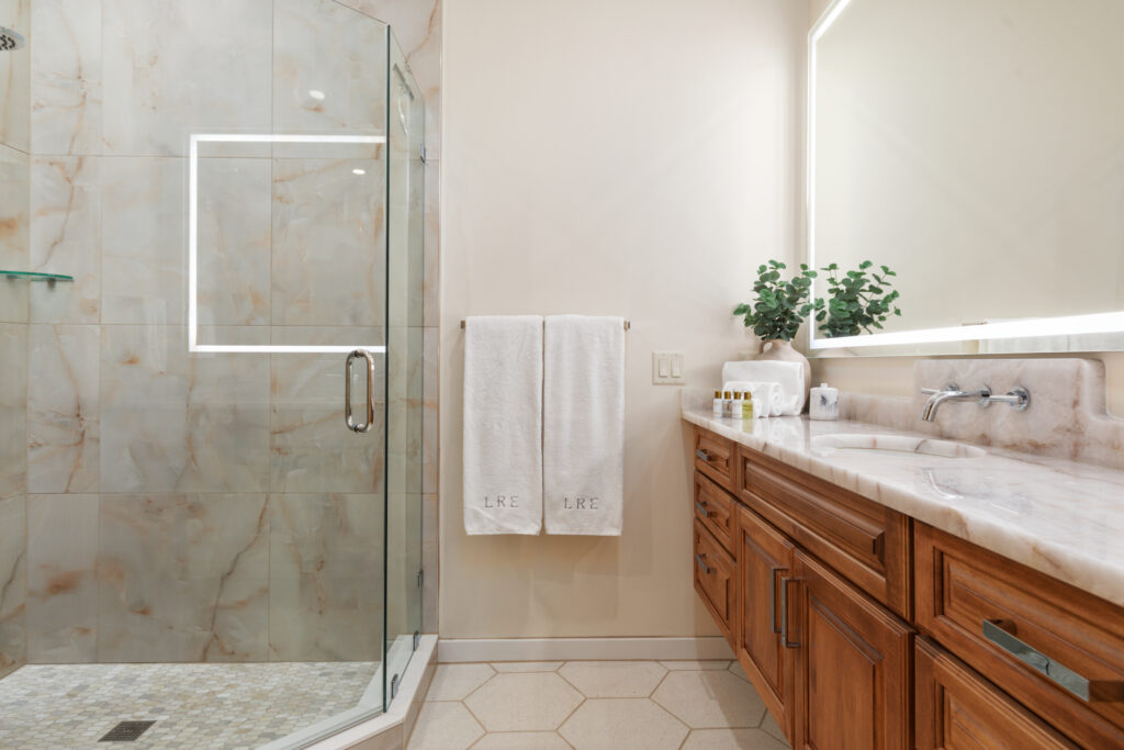 Luxury bathroom with glass shower at The Vale cabin in Lost River West Virginia