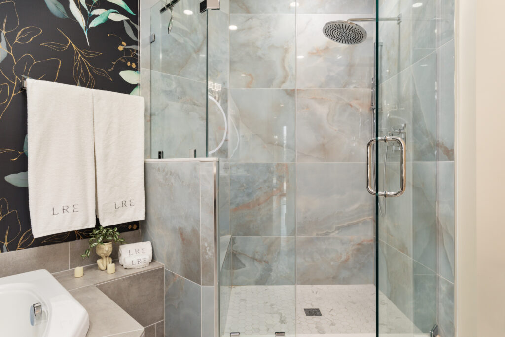 Luxury bathroom with glass shower at The Vale luxury cabin in Lost River West Virginia