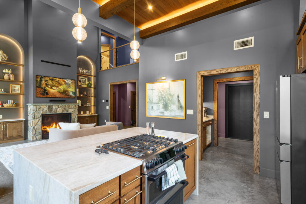 Chef's kitchen with professional range and wood cabinetry at The Nook
