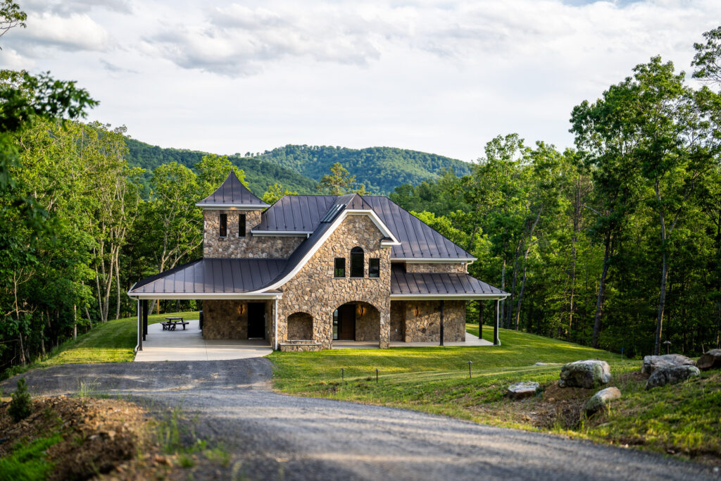 The Nook luxury cabin set against forested mountains in Lost River, West Virginia